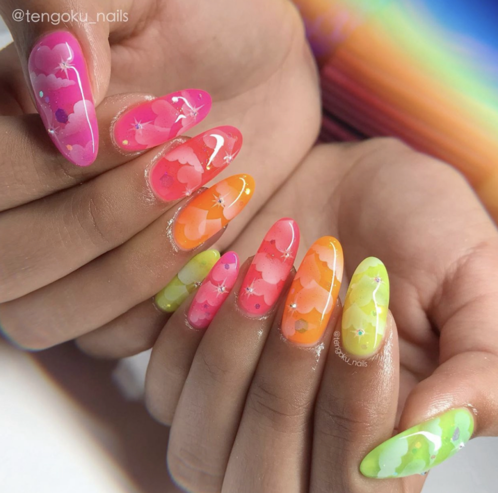 Colorful neon gel nail art with clouds